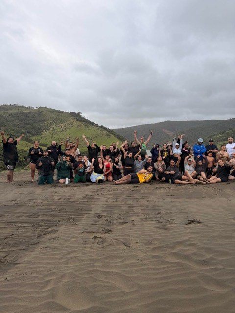 NTIB crew gathered together on the beach