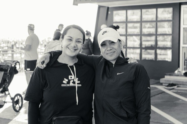 Two teammates sharing a moment during the group run