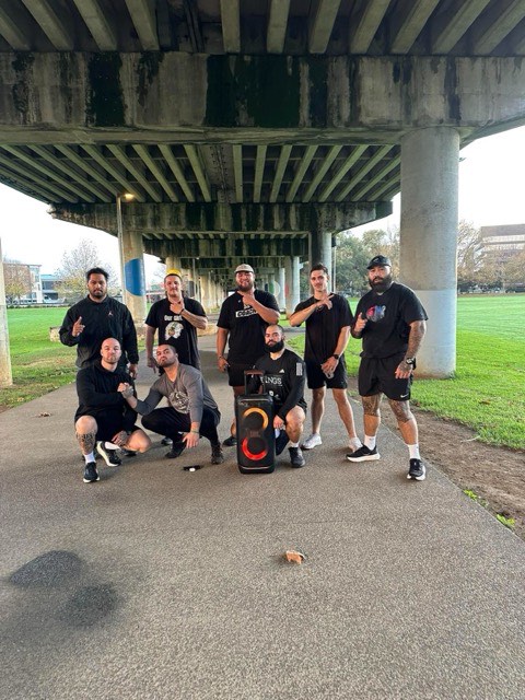The NTIB team gathered beneath a city overpass