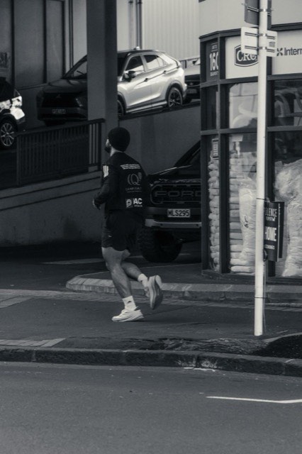 A black-and-white portrait of a runner after training