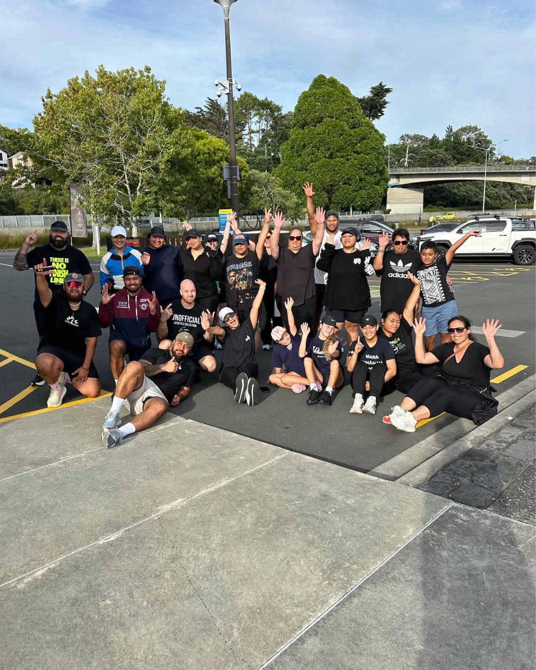 The NTIB crew together after a morning out in Auckland, smiling and waving
